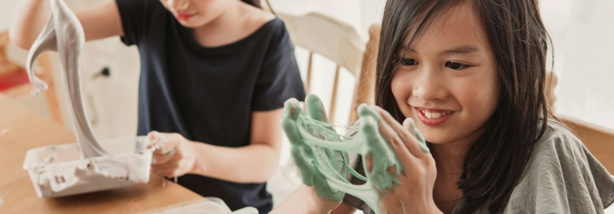 mixed Asian girl friends making slime, sensory craft, fun homeschool chemistry project