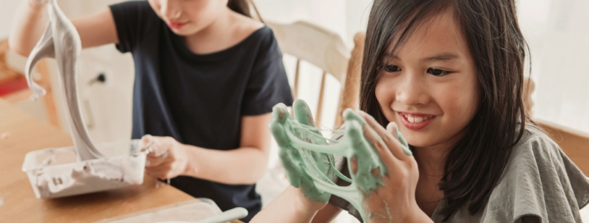 mixed Asian girl friends making slime, sensory craft, fun homeschool chemistry project