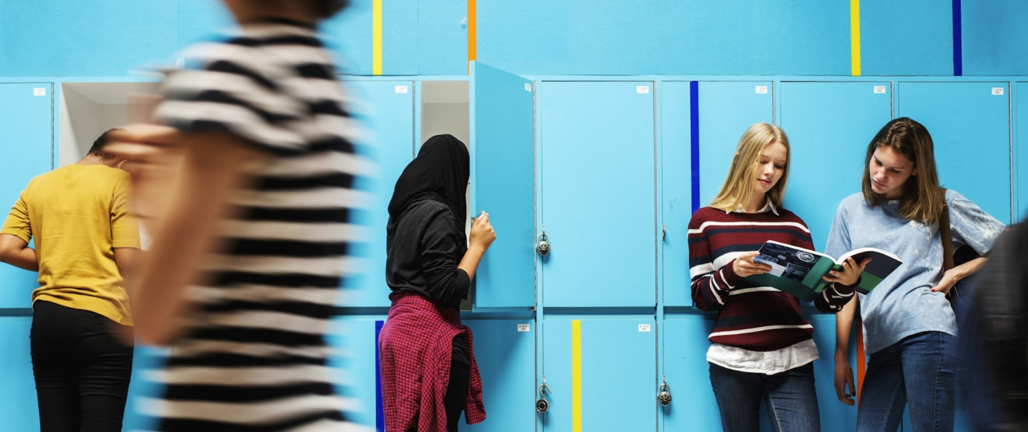 Students friends at lockers room